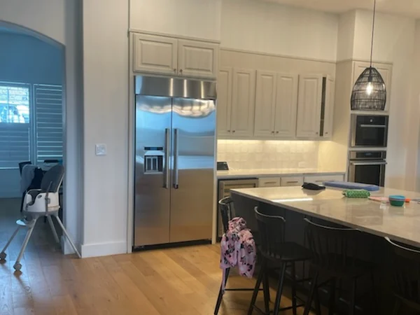 Kitchen remodel — Opened through to the dining room, hardwood carried across