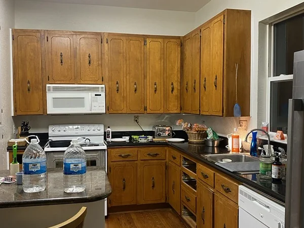 The same kitchen, before — Original oak, laminate tops