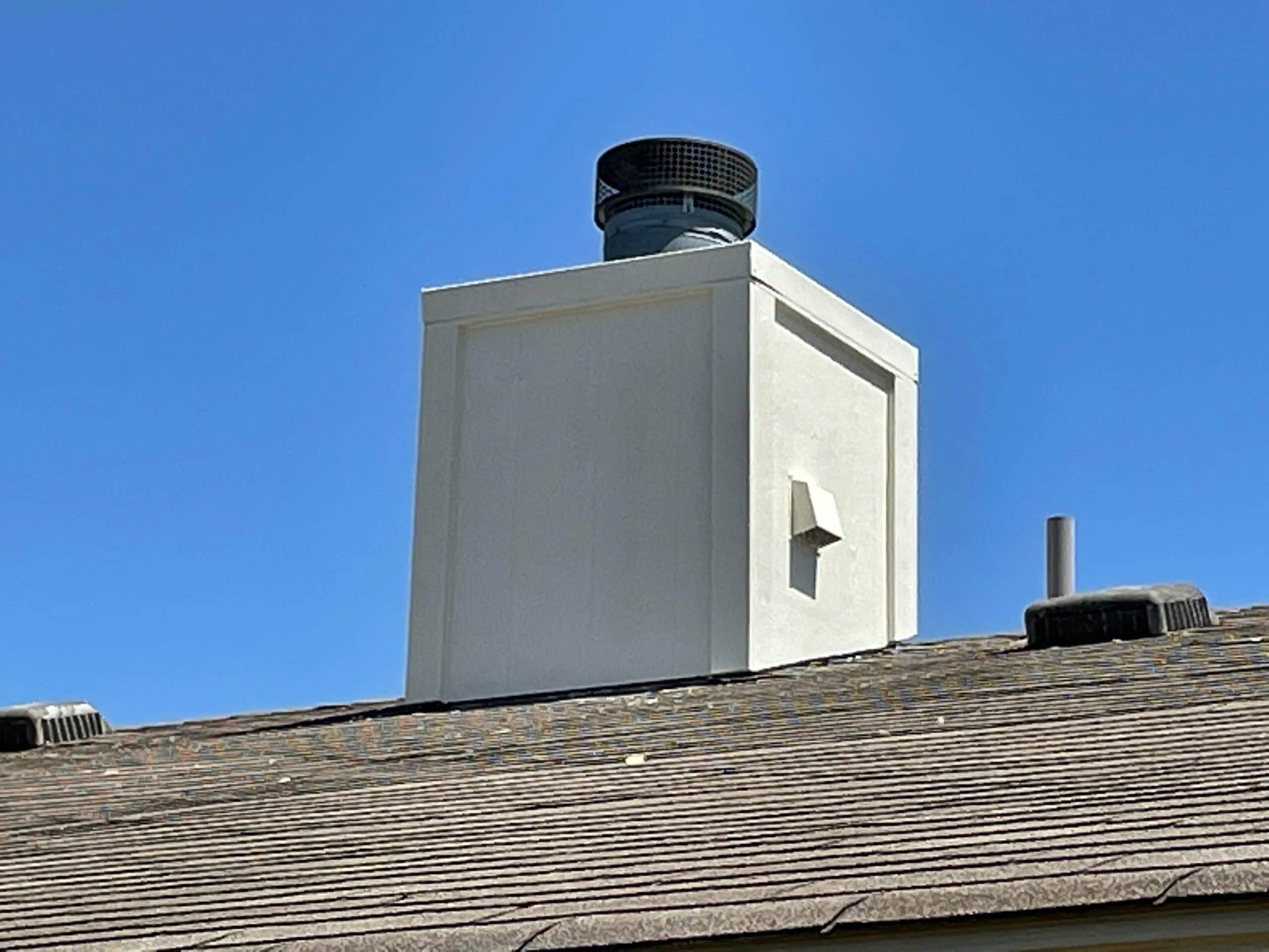 Chimney chase — Rebuilt, re-clad and capped
