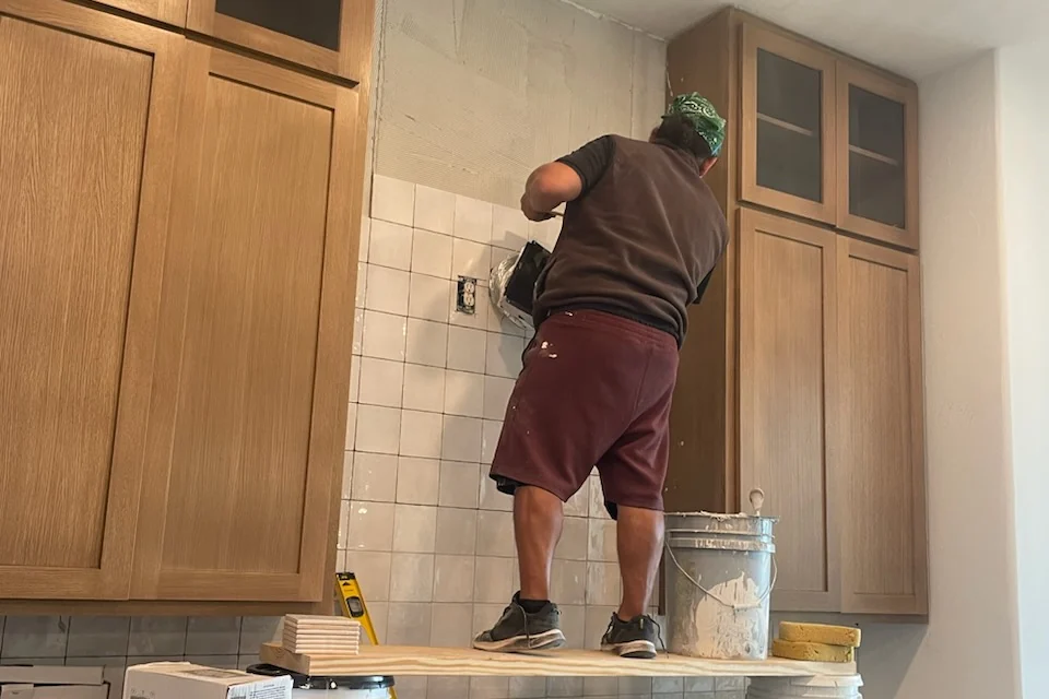 A finished Central Texas living space — new oak flooring, smooth walls and a board-and-batten accent wall